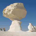 mushroom-shaped chalk rock formation standing prominently in the White Desert of Bahariya Oasis
